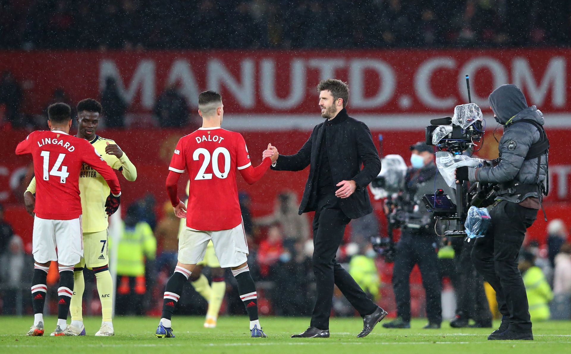 Michael Carrick congratulates his players.