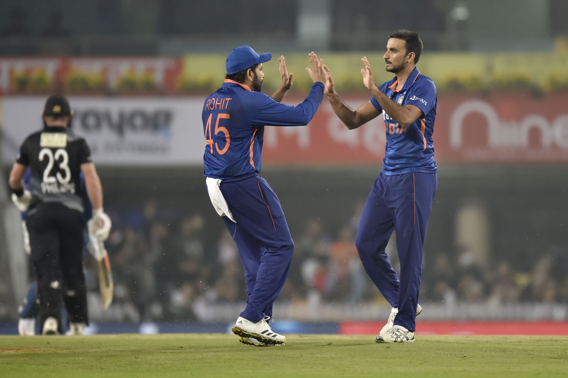 Harshal Patel (right) celebrates the wicket of Glenn Phillips. Pic: Getty Images