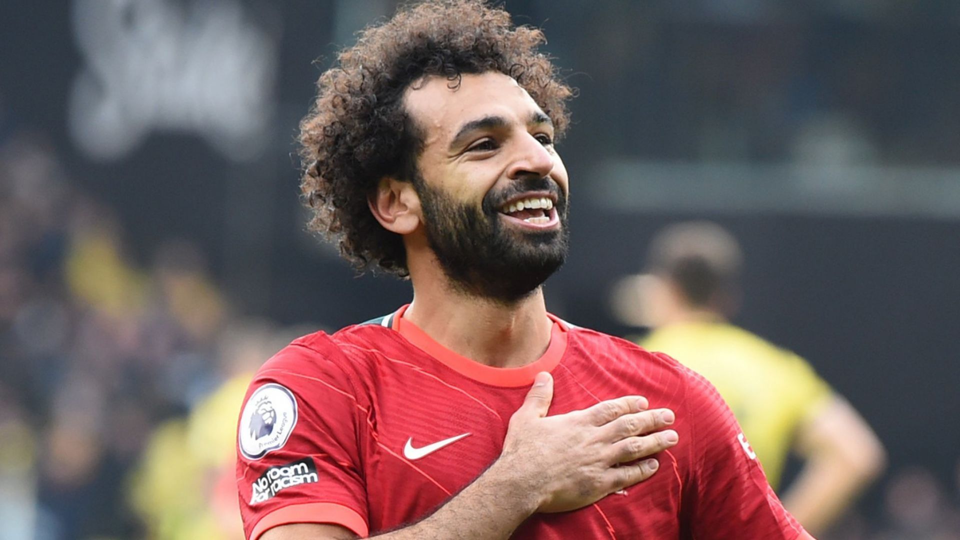 Mohamed Salah celebrating scoring a goal for Liverpool in the Premier League.