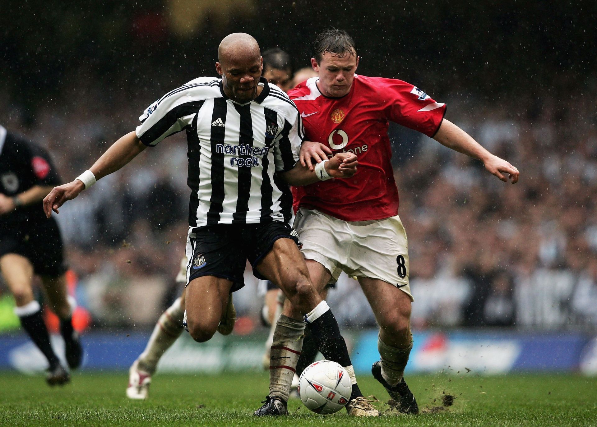 Jean-Alain Boumsong battles with Wayne Rooney in the FA Cup semifinal