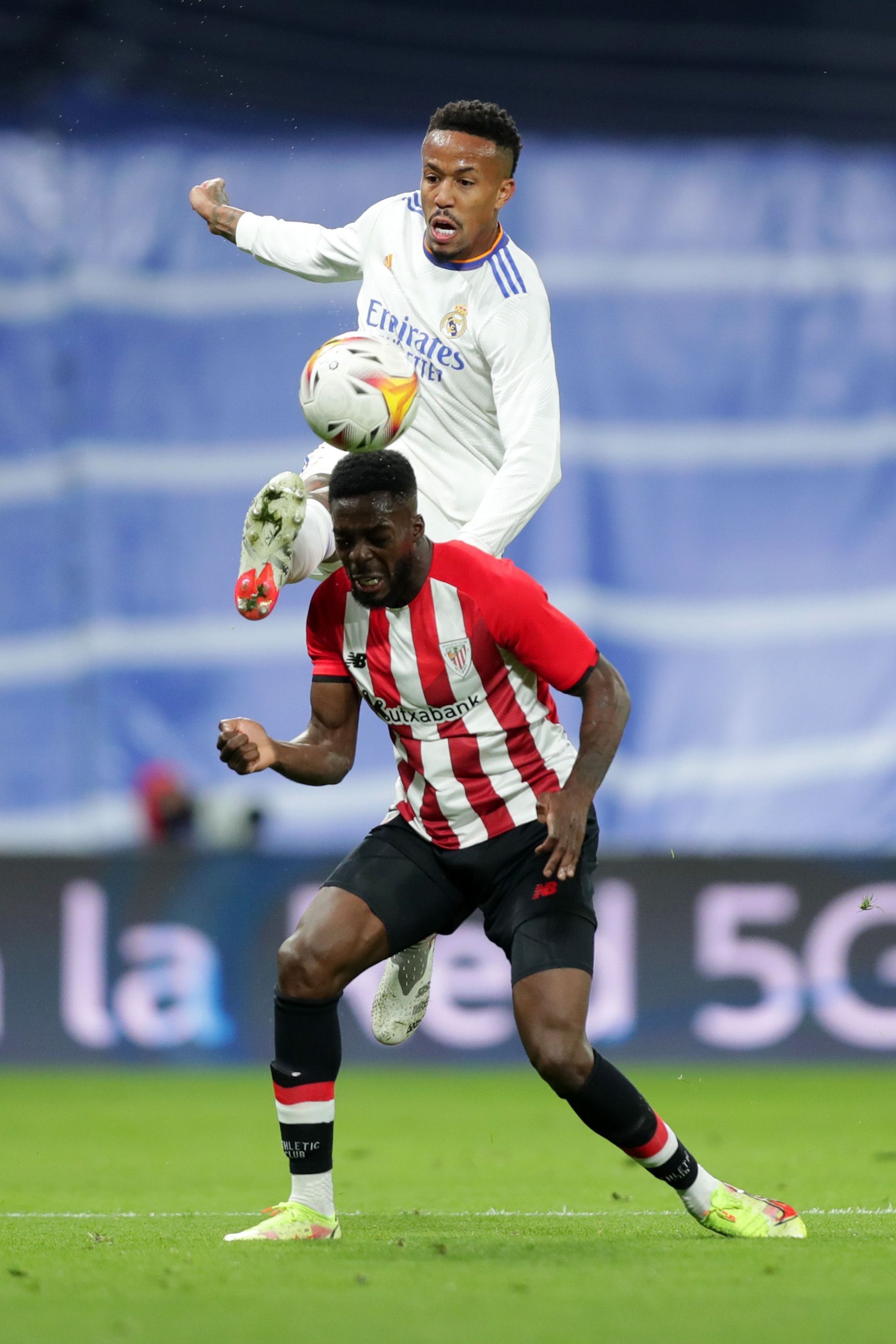 Inaki Williams tussles it out with Eder Militao.