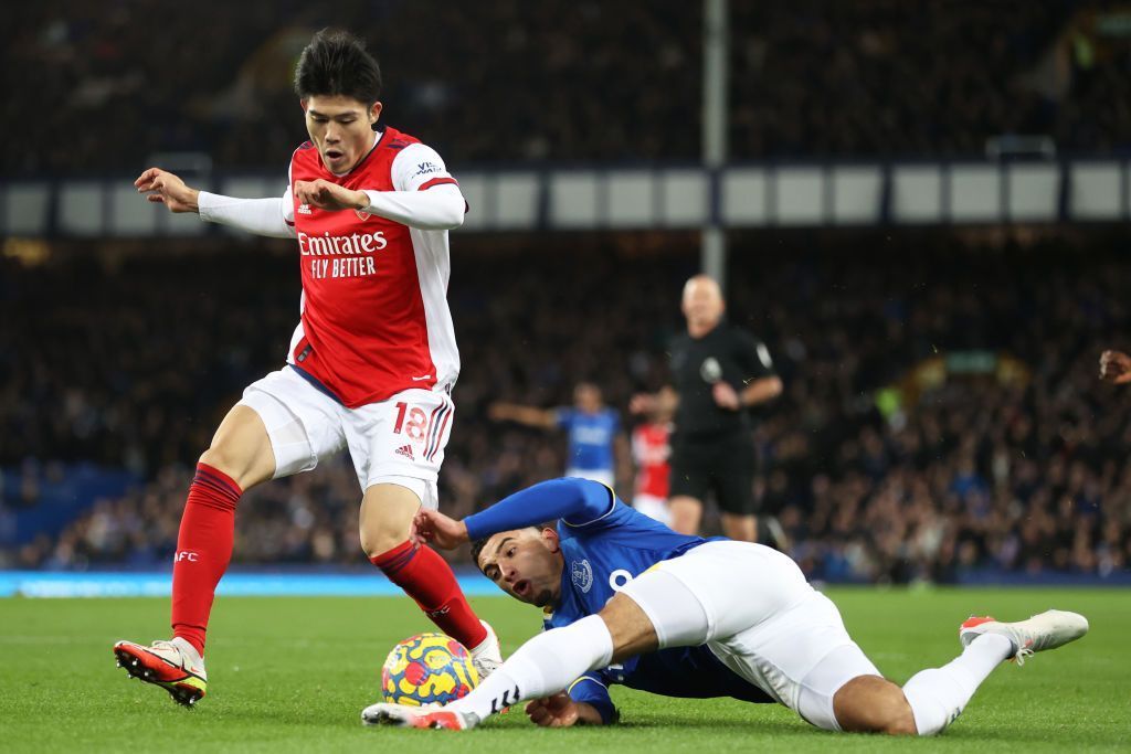 Godfrey (right) escaped a red card, in a huge let off for Everton.