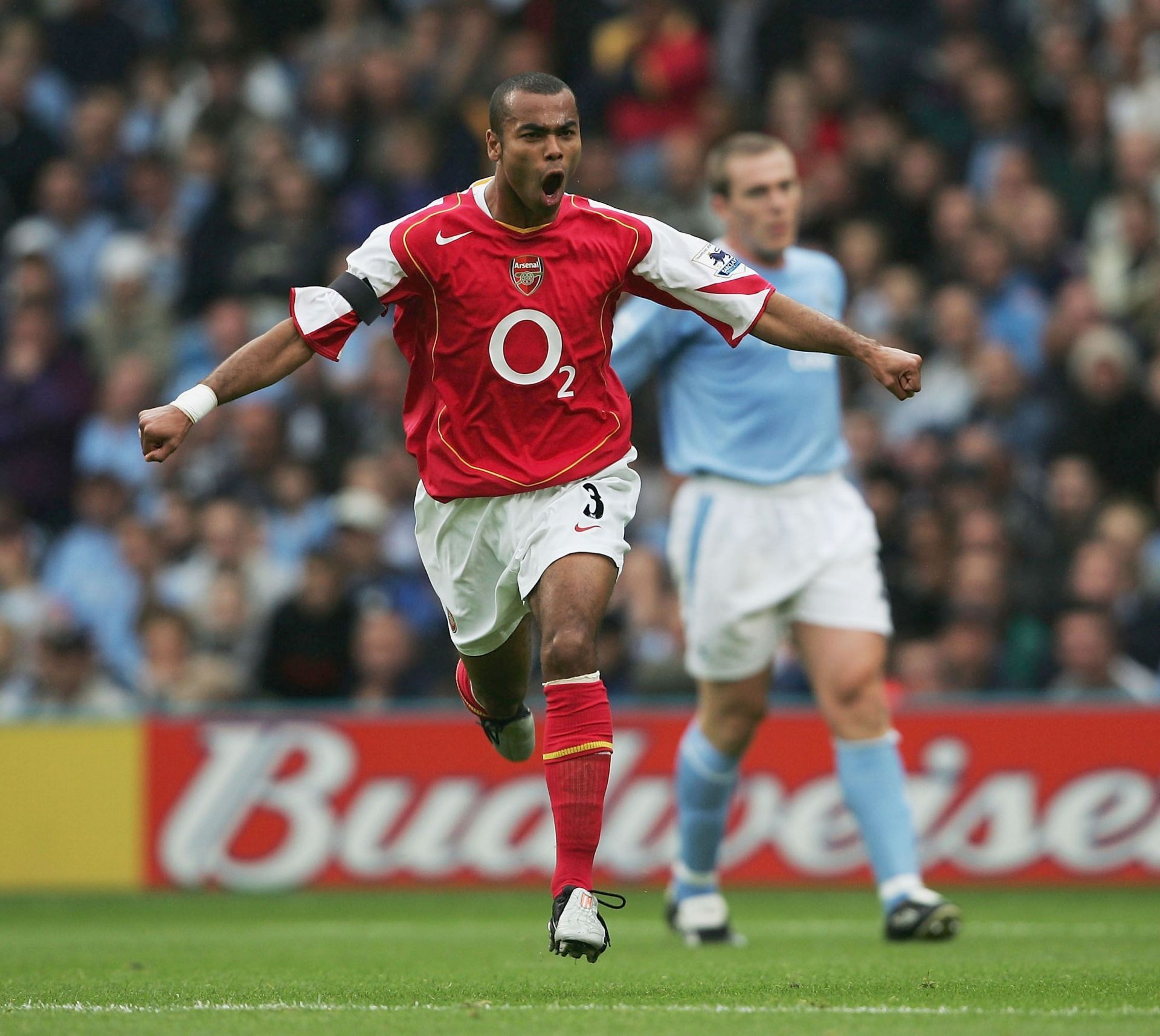 Cole celebrates after scoring away to Manchester City