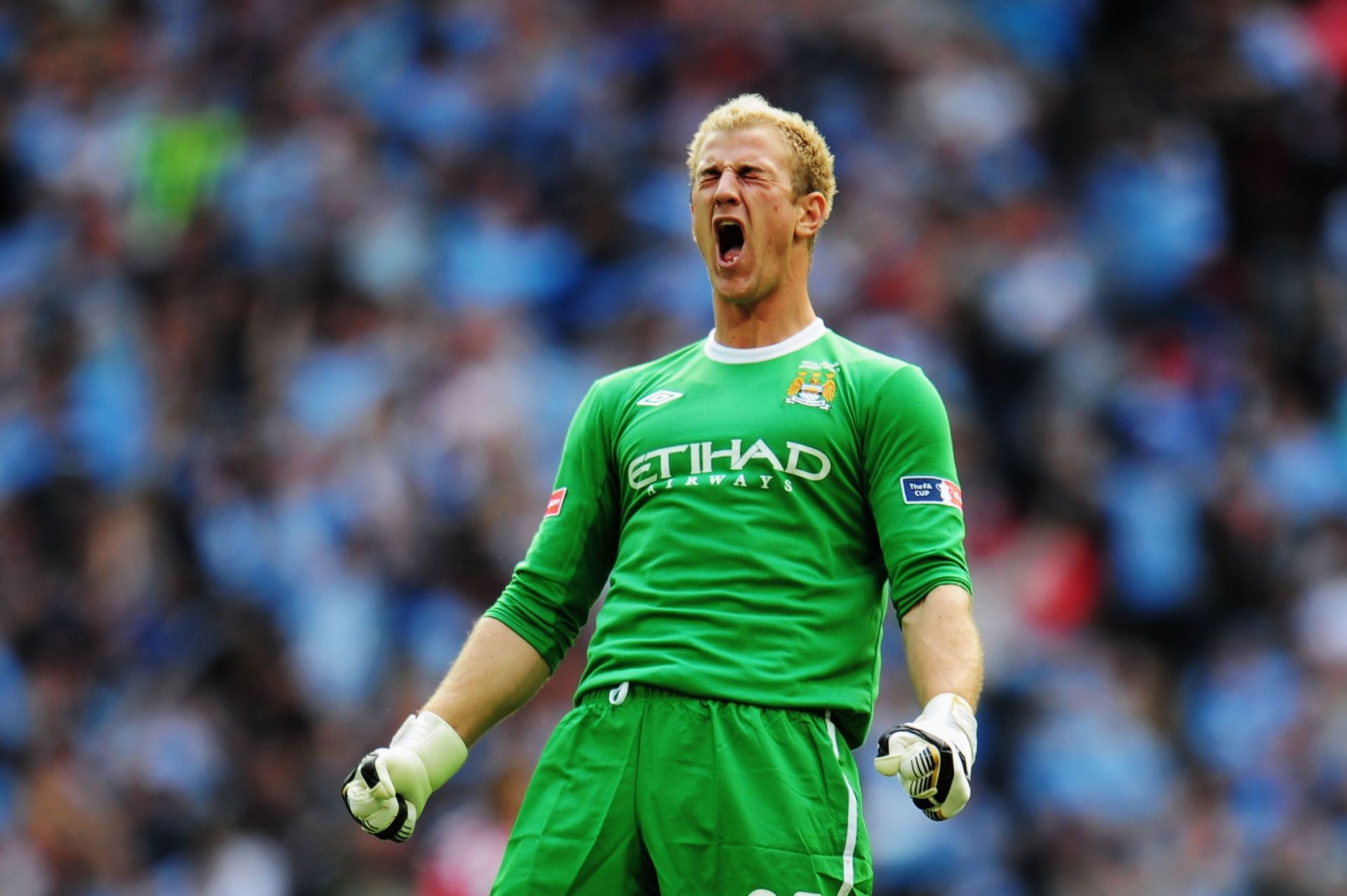 Joe Hart passionately celebrating a goal scored by Manchester City