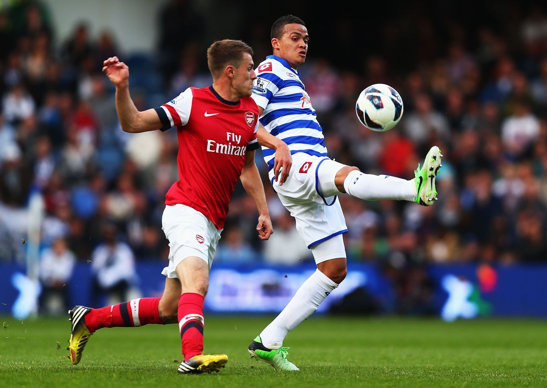 Jenas in his QPR days, battling with Arsenal's Aaron Ramsey.