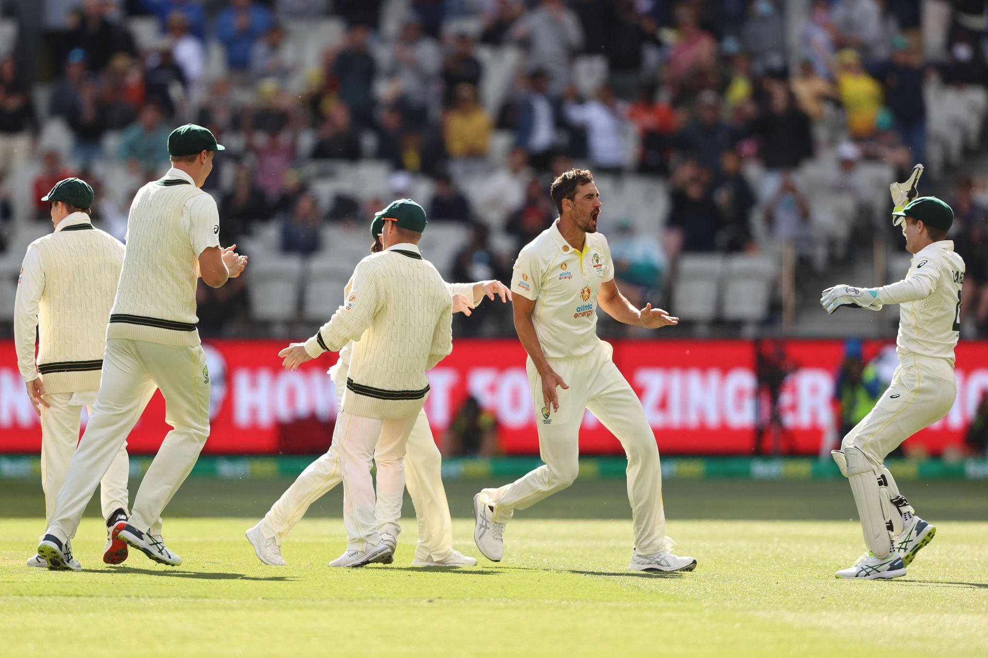 Mitchell Starc celebrates with teammates after dismissing Dawid Malan. Pic: Getty Images