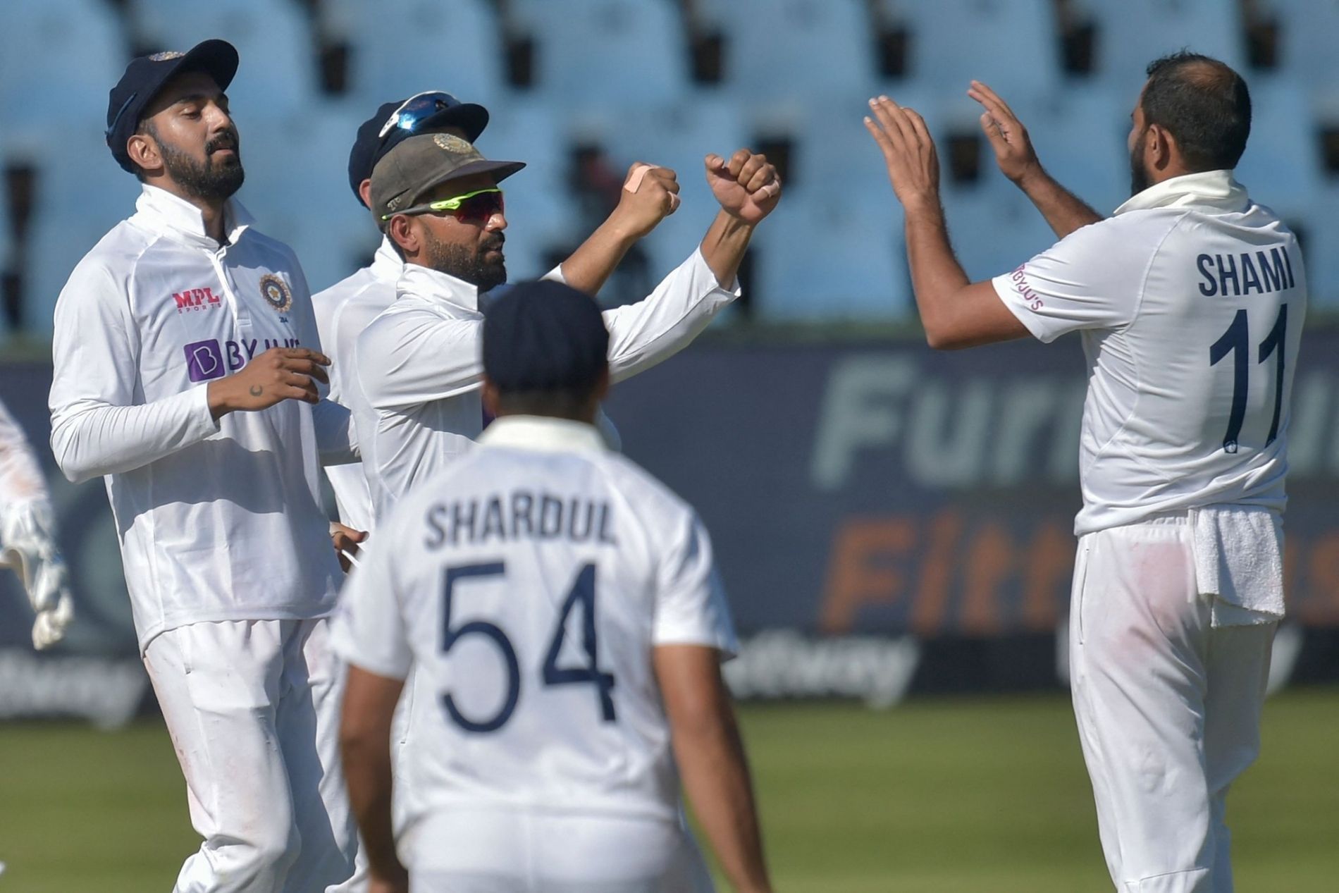 Mohammed Shami (right) celebrates a wicket with teammates. Pic: Getty Images