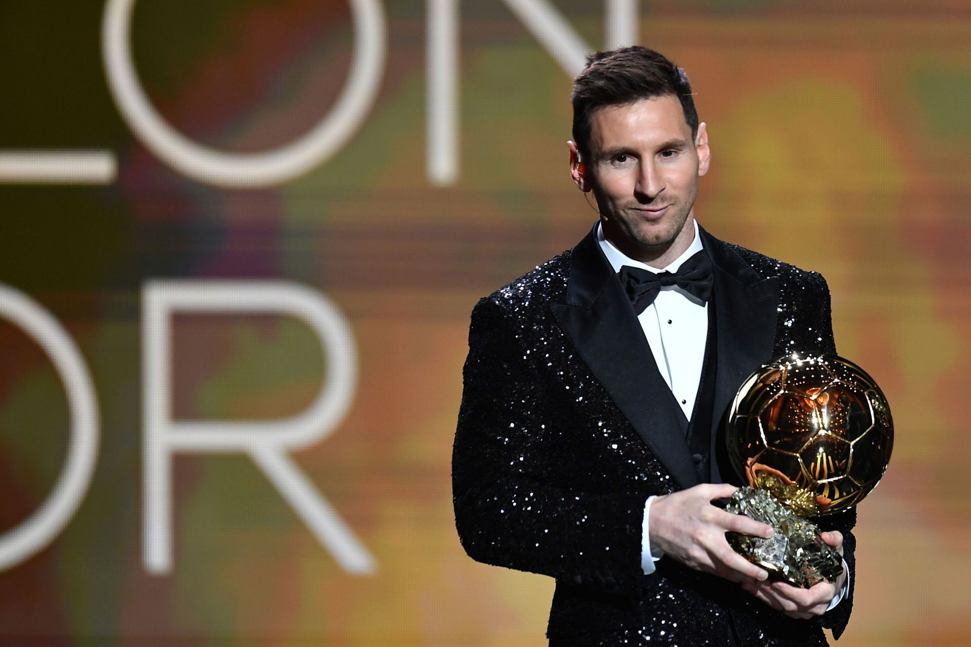 Lionel Messi holding up his seventh Ballon d&#039;Or award