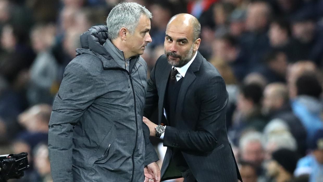 Jose Mourinho and Pep Guardiola in conversation before a game.