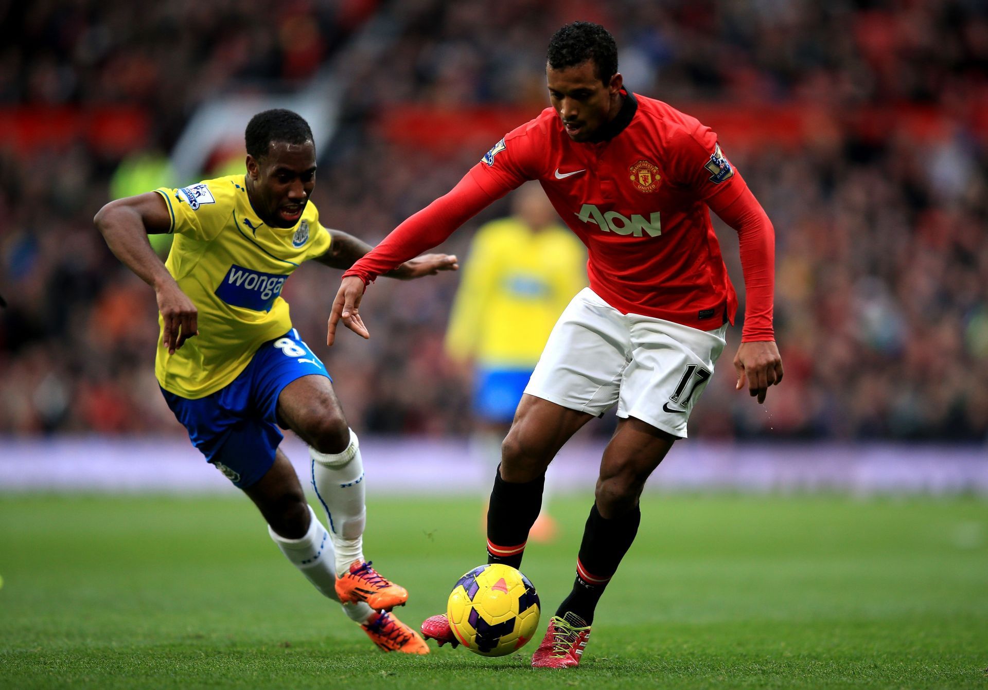 Manchester United&#039;s Nani (#17) gets past Vernon Anita of Newcastle United