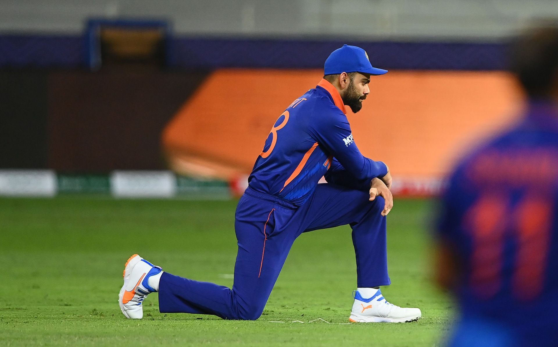 Virat Kohli takes a knee during the T20 World Cup. Pic: Getty Images