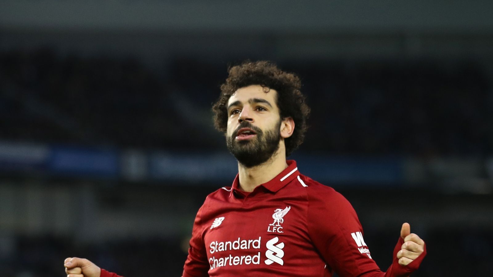 Mohamed Salah celebrating scoring a goal for Liverpool in the Premier League