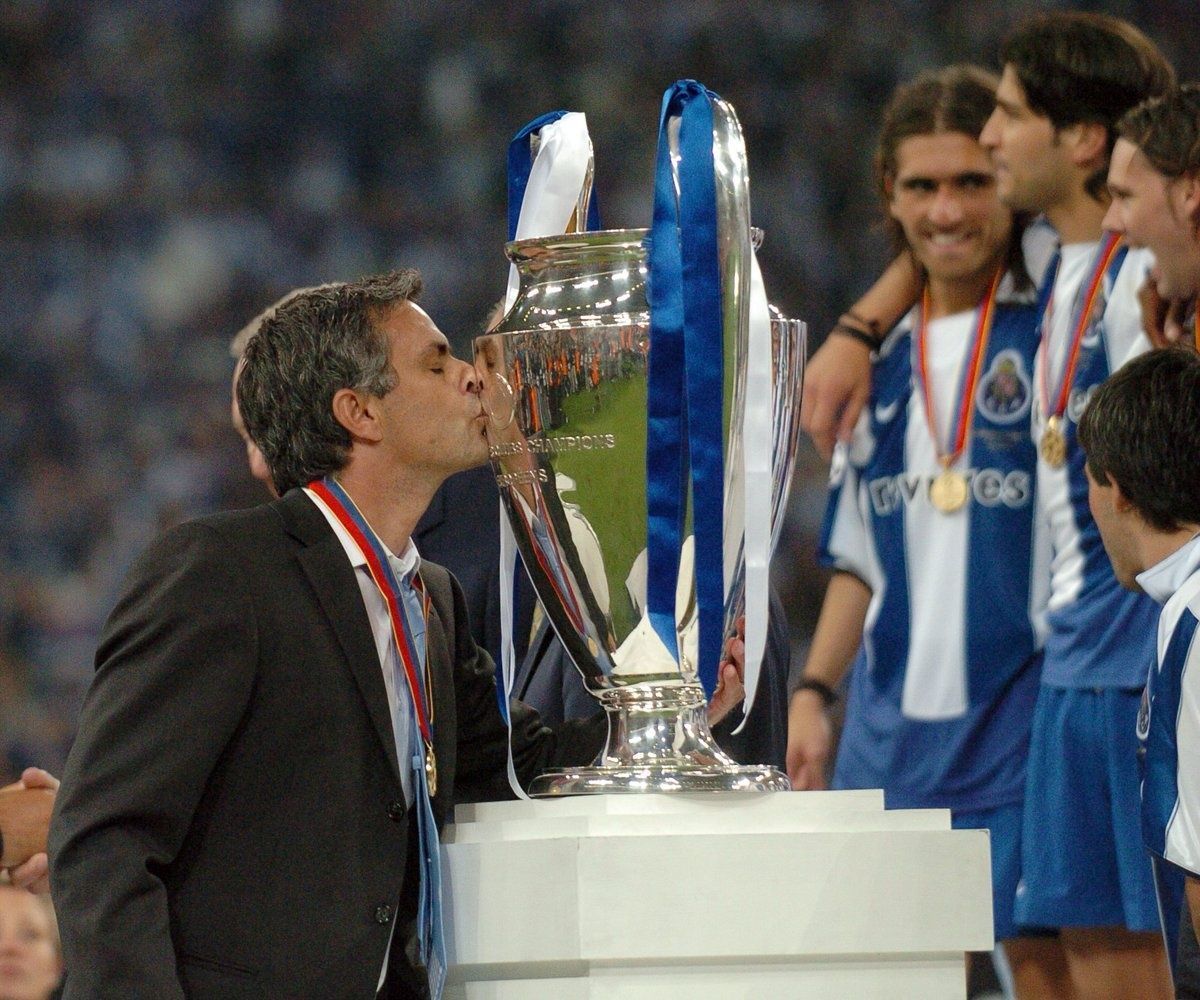 Former FC Porto manager Jose Mourinho kisses the Champions League trophy after his team's triumph in 2004.