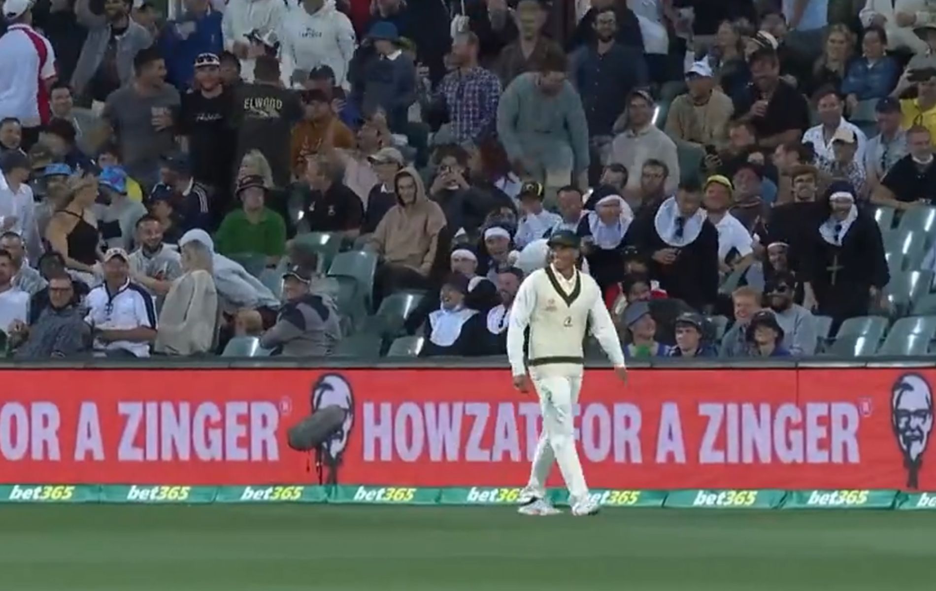 Usman Khawaja smiles after doing a jig for the crowd at the Adelaide Oval on Day 2 of the 2nd Ashes Test