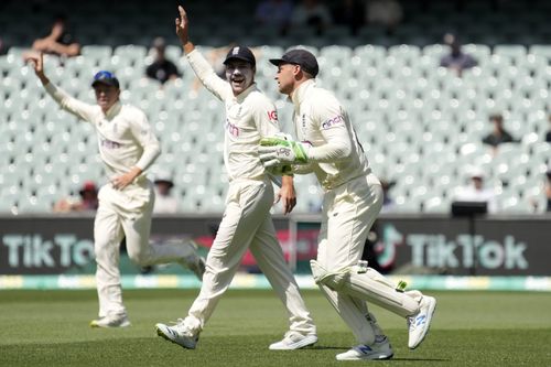 Jos Buttler celebrates after taking a good catch to send Steve Smith packing.