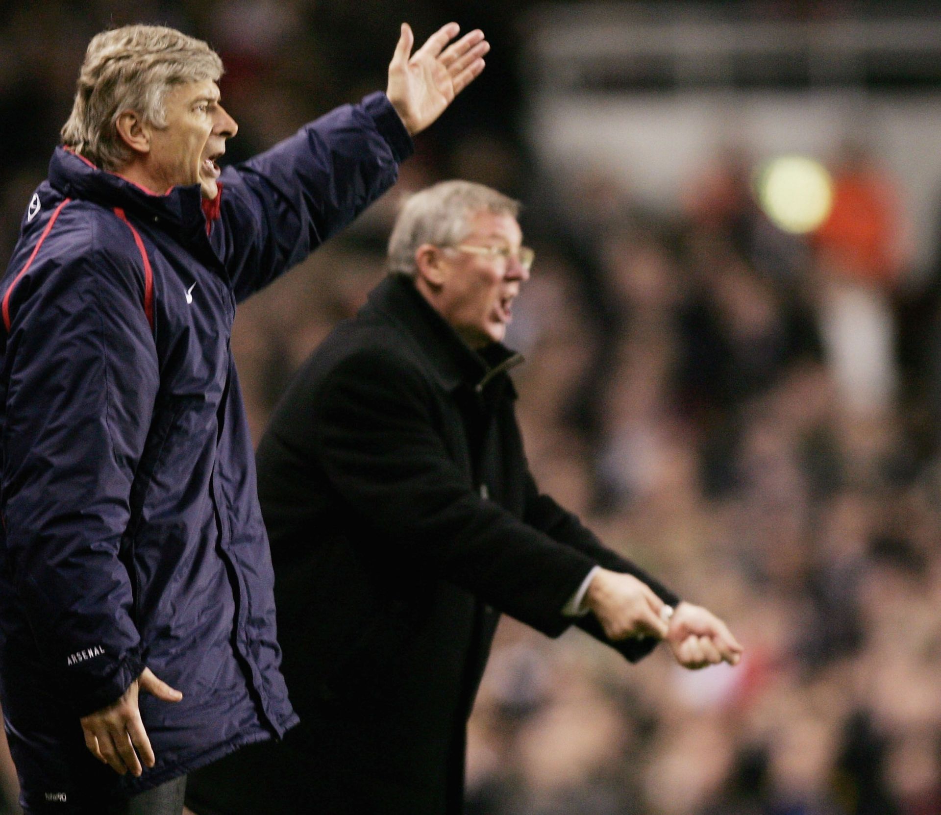 Arsene Wenger (left) and Sir Alex Ferguson yelling instructions at their players.