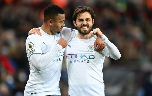 Gabriel Jesus and Bernardo Silva of Manchester City