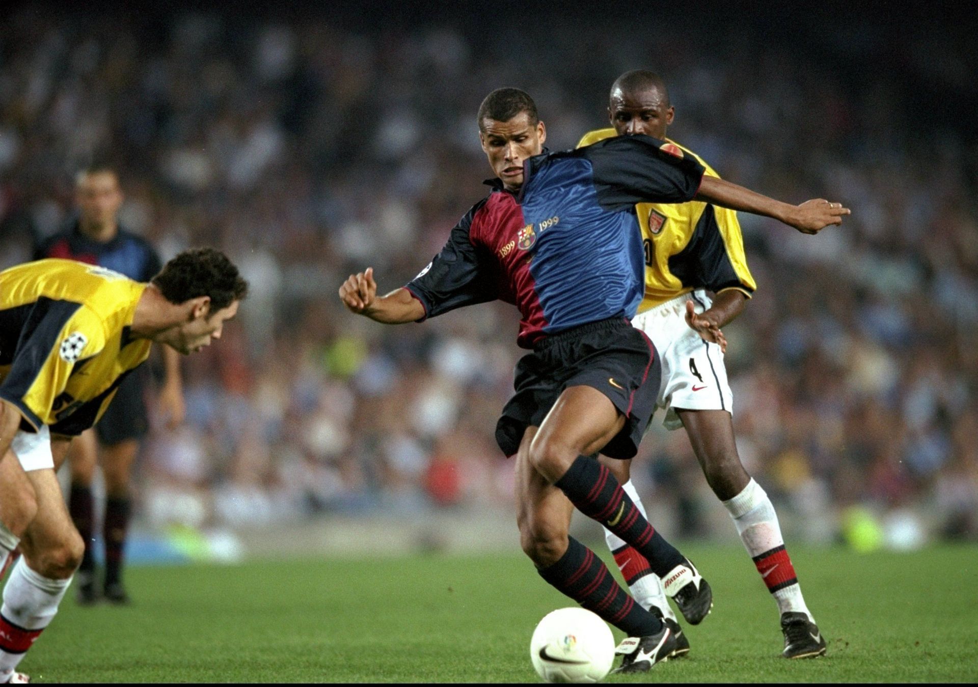 Rivaldo of Barcelona (centre),Martin Keown (left) and Patrick Vieira (right) of Arsenal