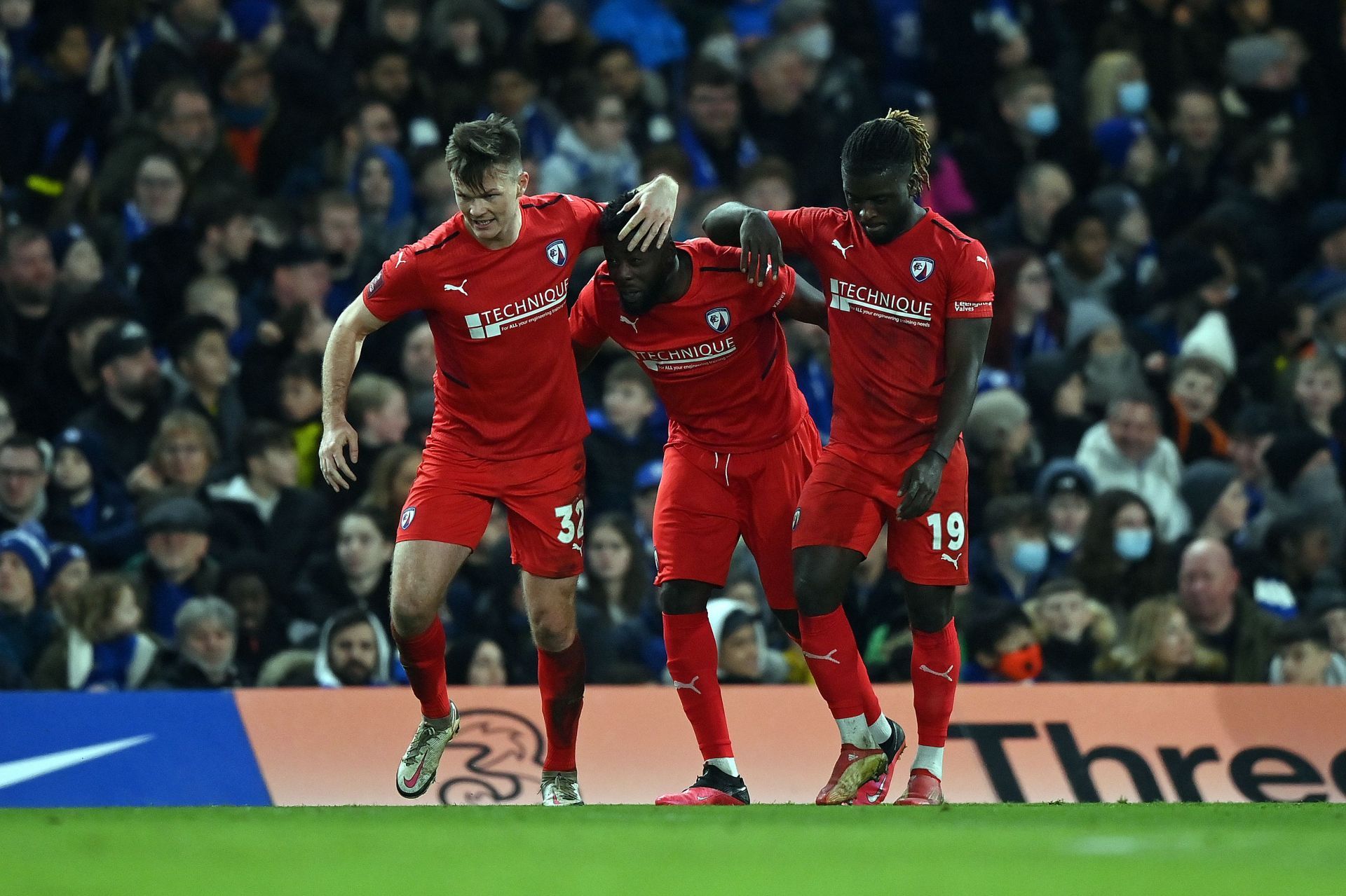 Chesterfield&#039;s front three celebrate a goal against Chelsea.