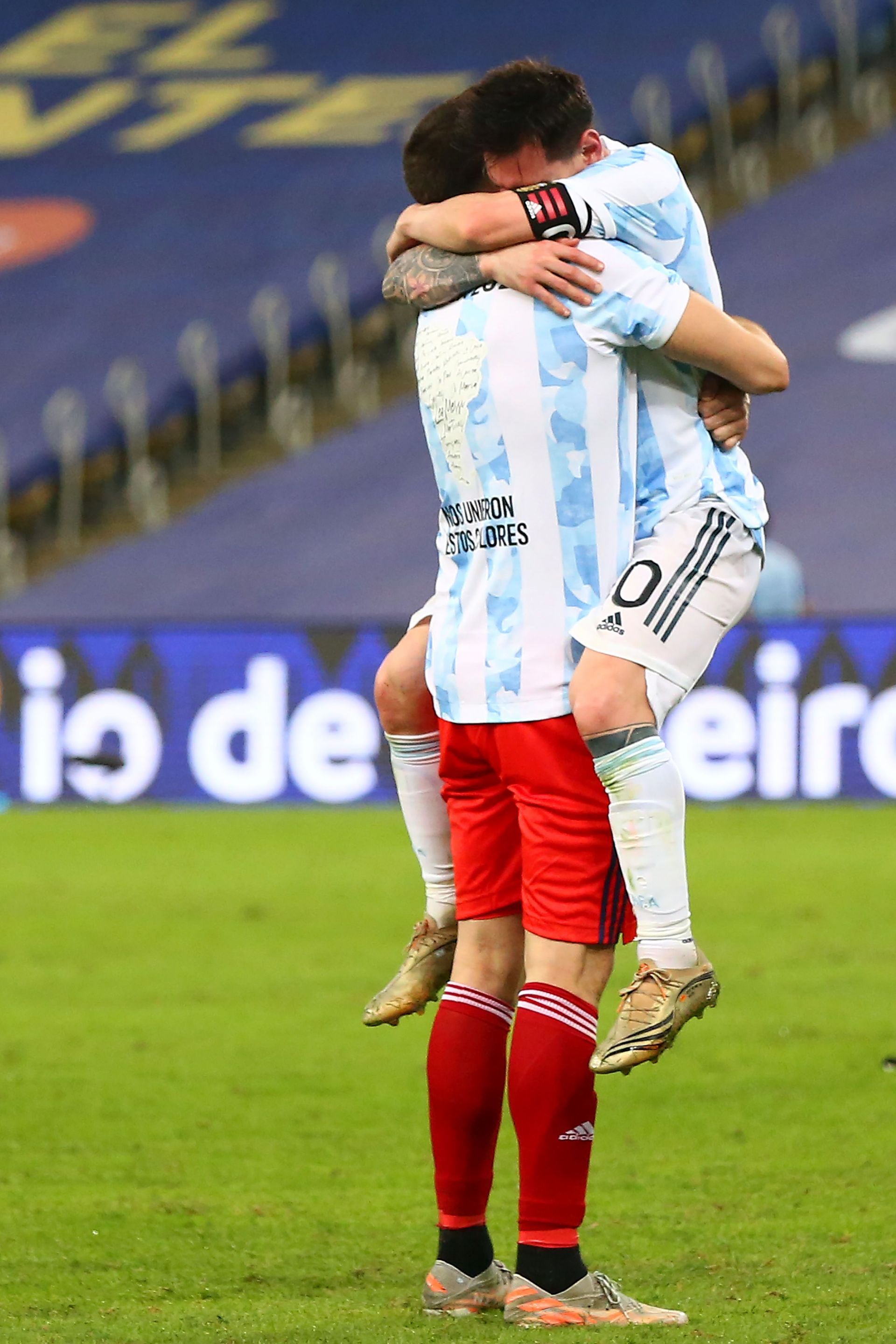 Messi and Martinez hugging each other after beating Brazil in the Copa America final last year
