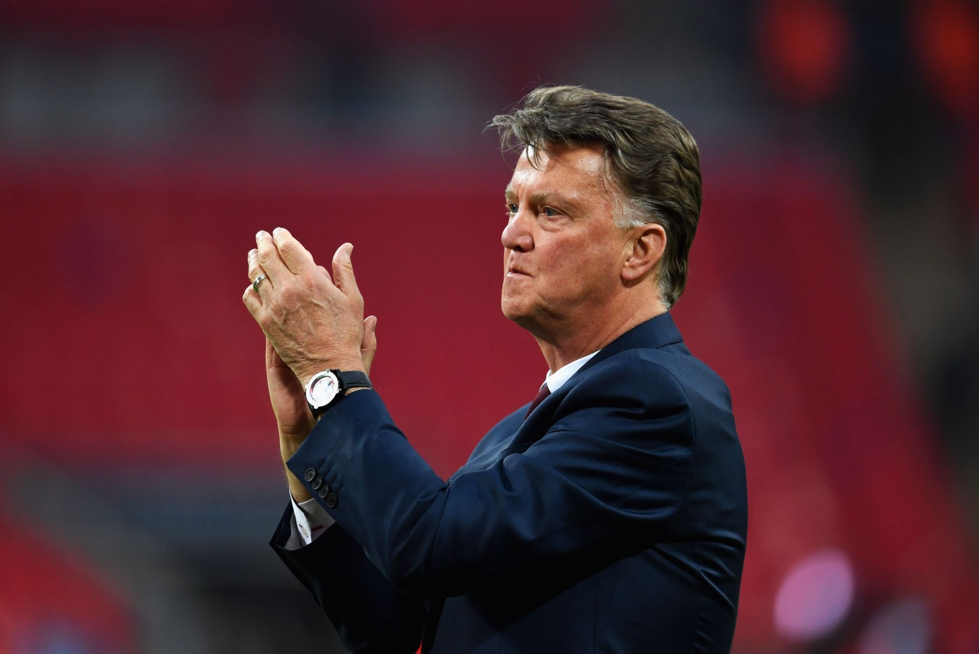 Louis van Gaal applauds the Red Devils fans after winning the 2016 FA Cup.