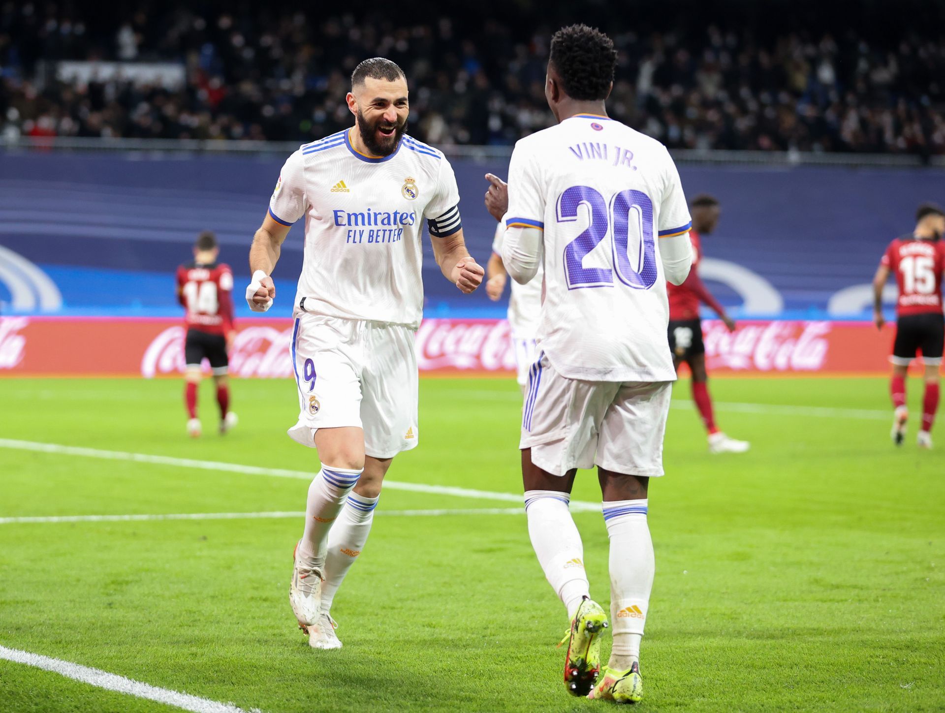 Karim Benzema celebrates with Vinicius Jr.