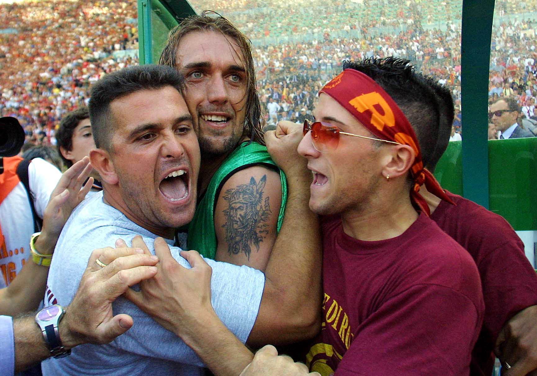 Gabriel Batistuta celebrates winning the scudetto with Roma fans.