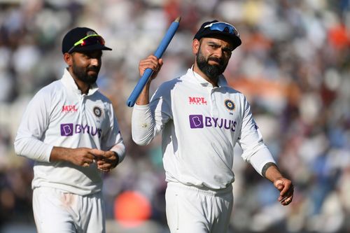 Virat Kohli celebrates India's win in the fourth Test over England.