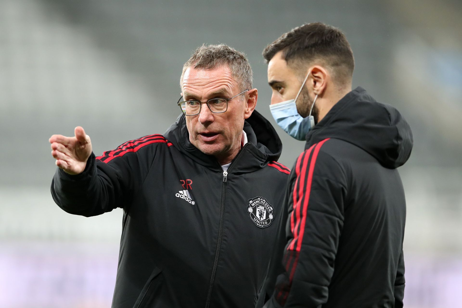 Ralf Rangnick (left) and Bruno Fernandes in discussion before a Manchester United fixture