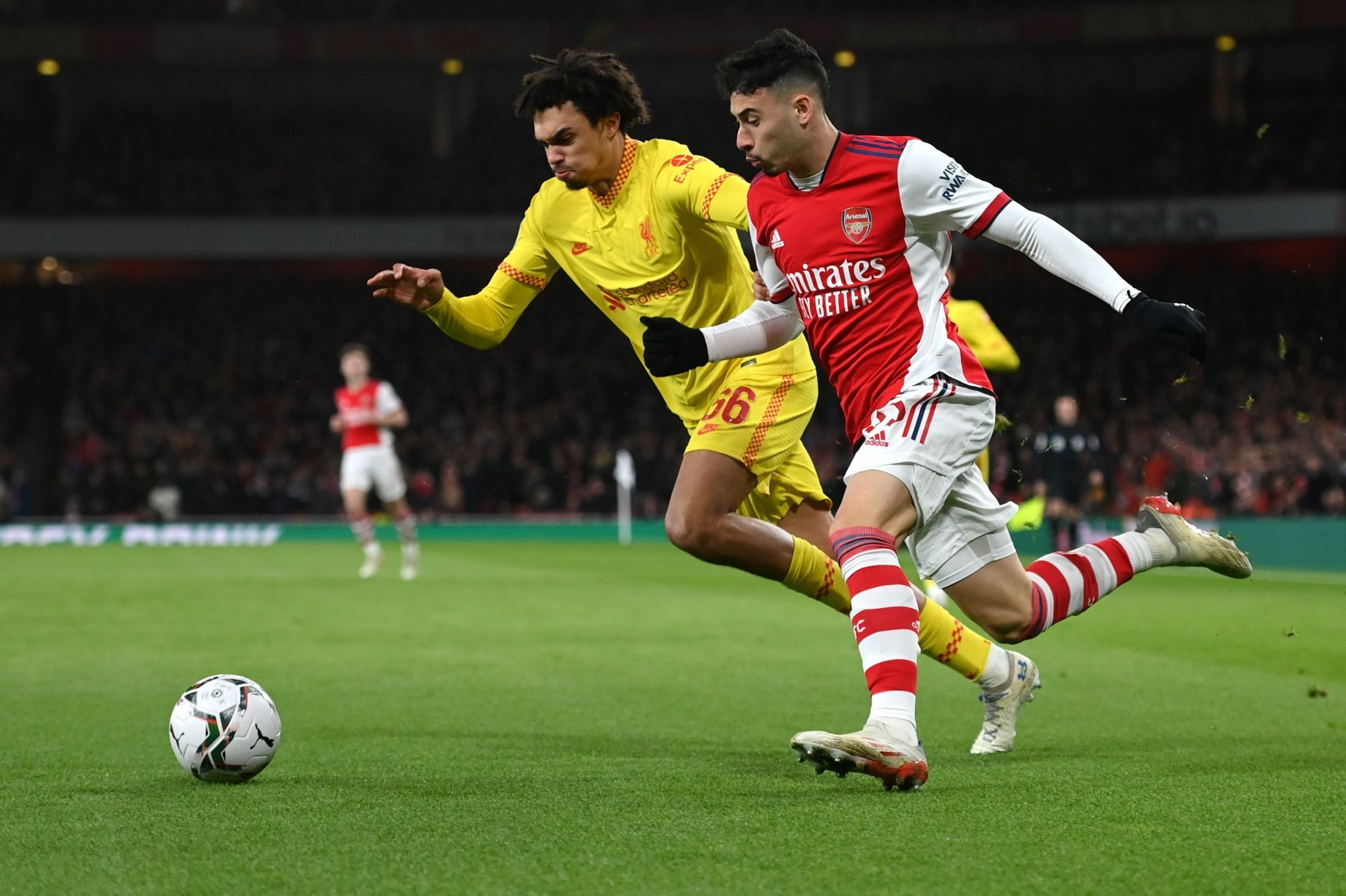 Trent Alexander-Arnold tussles it out with Gabriel Martinelli.