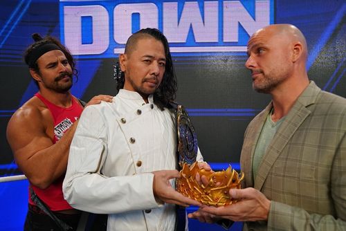 Rick Boogs (L) with Shinsuke Nakamura (C) and Adam Pearce (R)