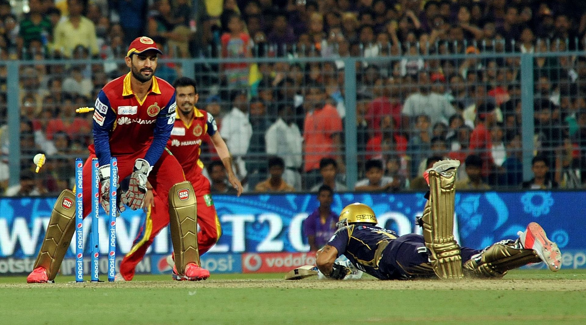 Dinesh Karthik in action against Kolkata Knight Riders while playing for RCB in 2015 IPL