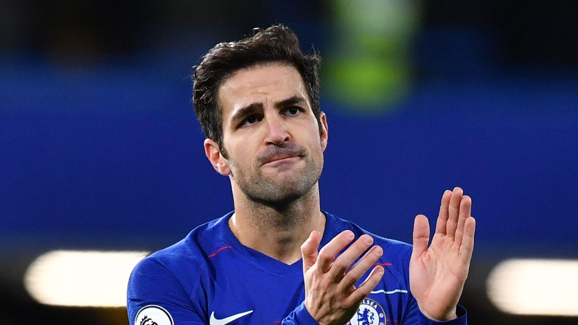 Cesc Fabregas applauding Chelsea fans after a Premier League game at Stamford Bridge.