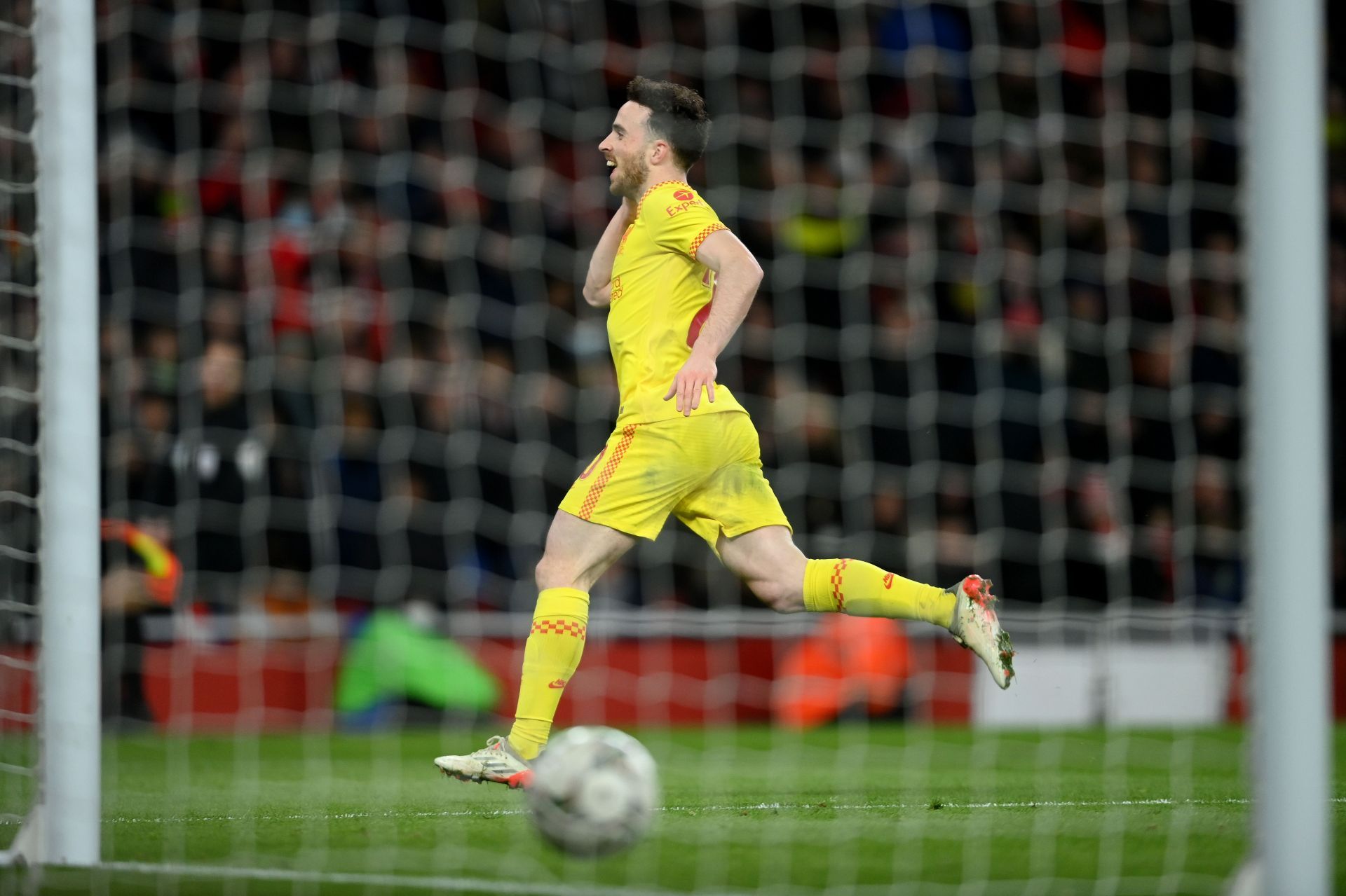 Liverpool&#039;s Diogo Jota rejoices after scoring against Arsenal.