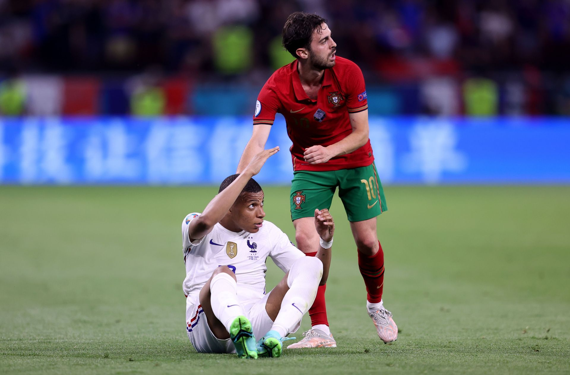 Bernardo Silva (right) and Kylian Mbappe of France.