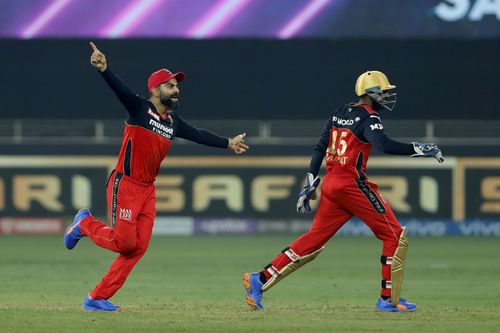 Virat Kohli (left) celebrates a wicket during IPL 2021. Pic: IPLT20.COM