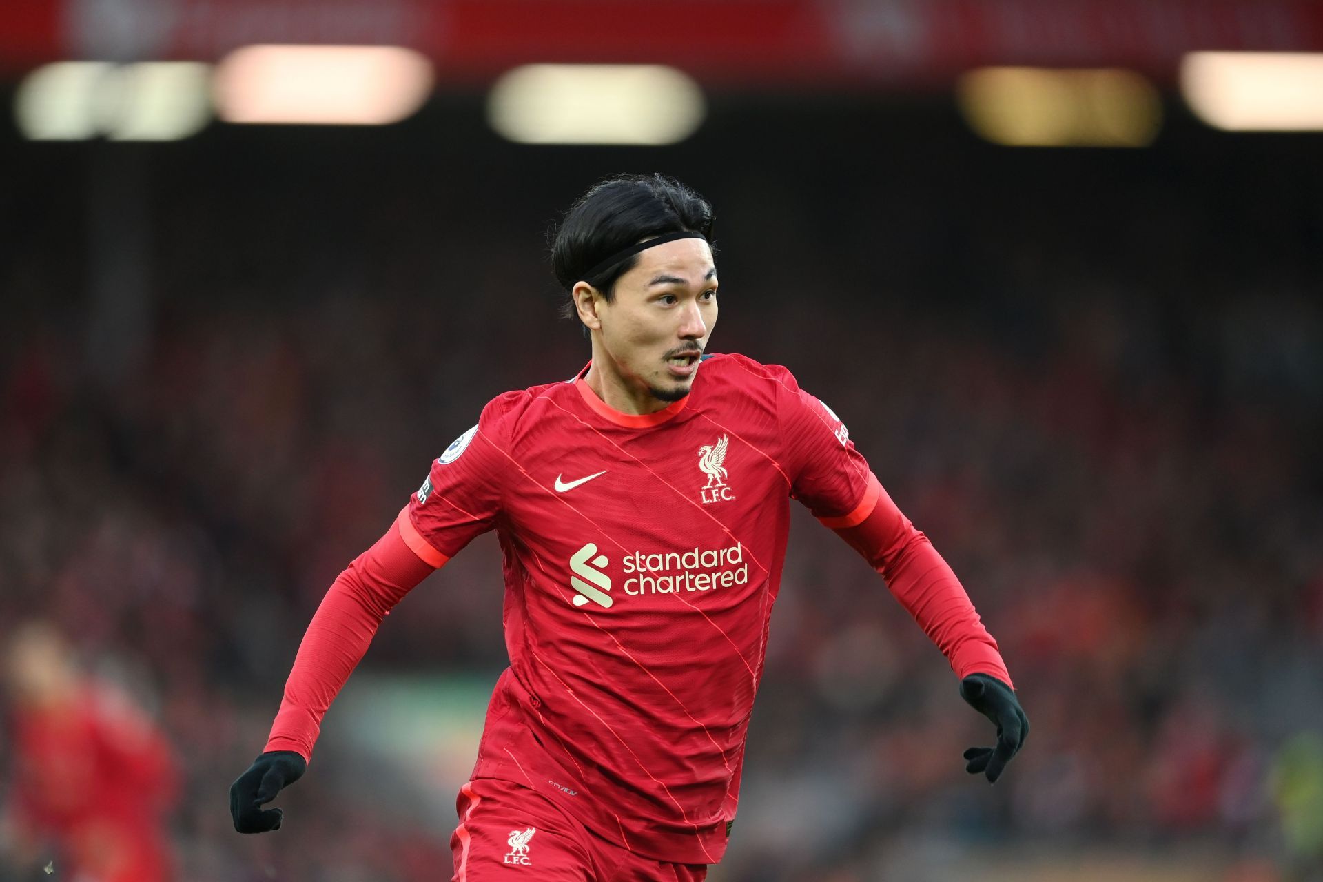 Takumi Minamino rejoices after scoring for Liverpool against Brentford.