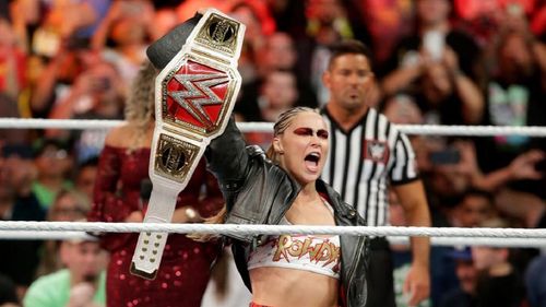 Ronda Rousey holding the RAW Women's title