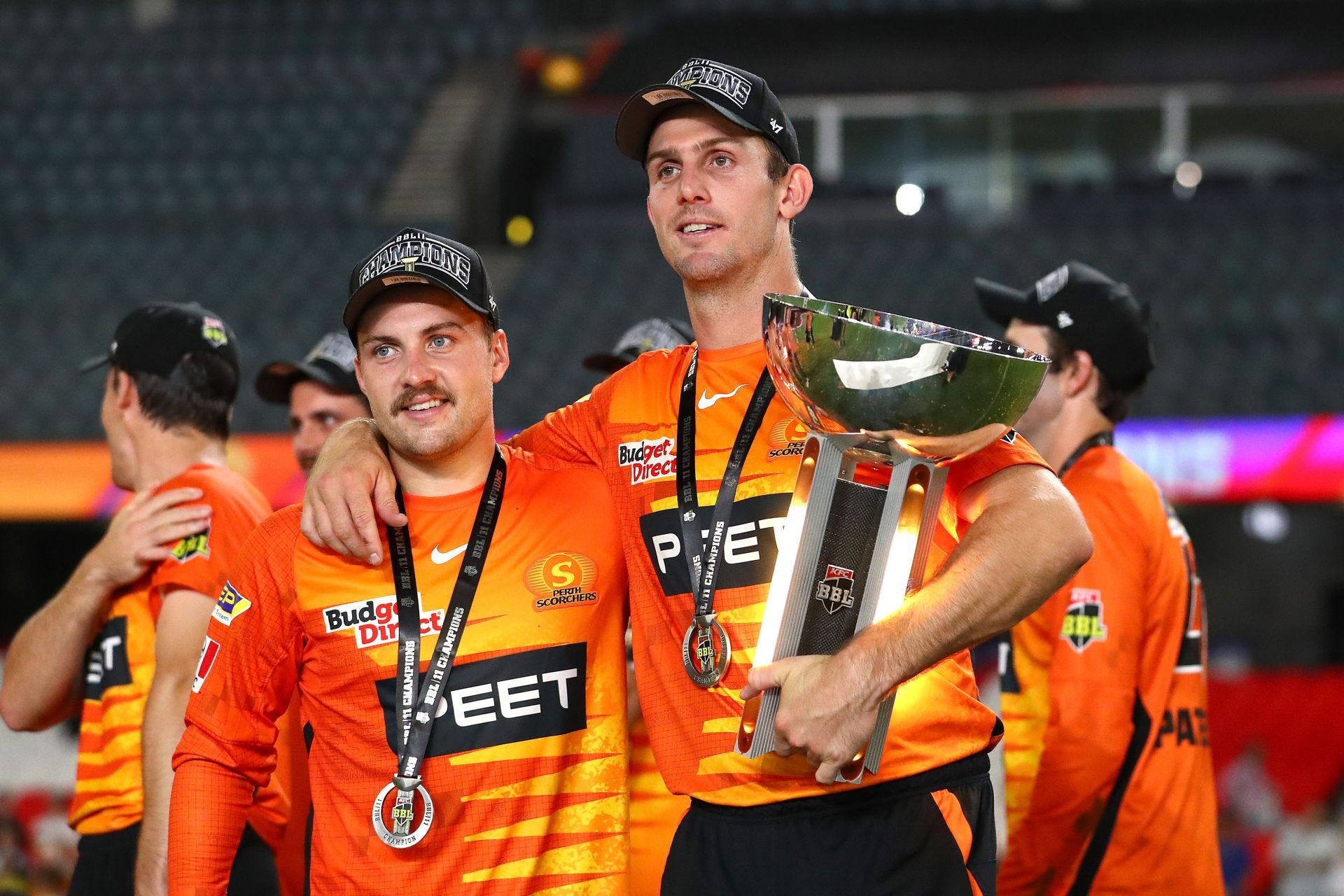 Mitchell Marsh (right) celebrates BBL 2021-22 win as a Perth Scorchers player.