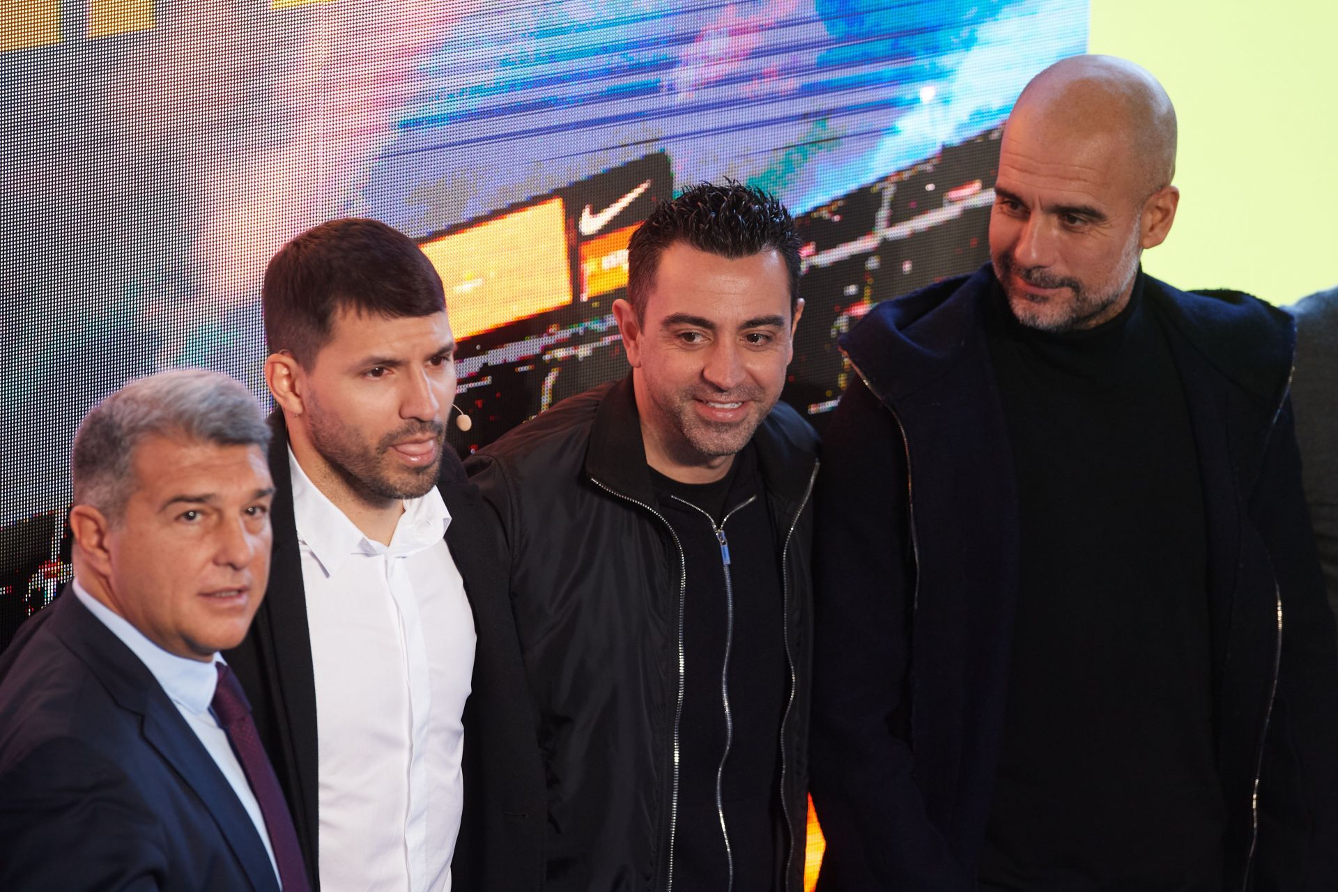 Current Barcelona manager Xavi (C) along with Pep Guardiola (right) and Sergio Aguero (left)