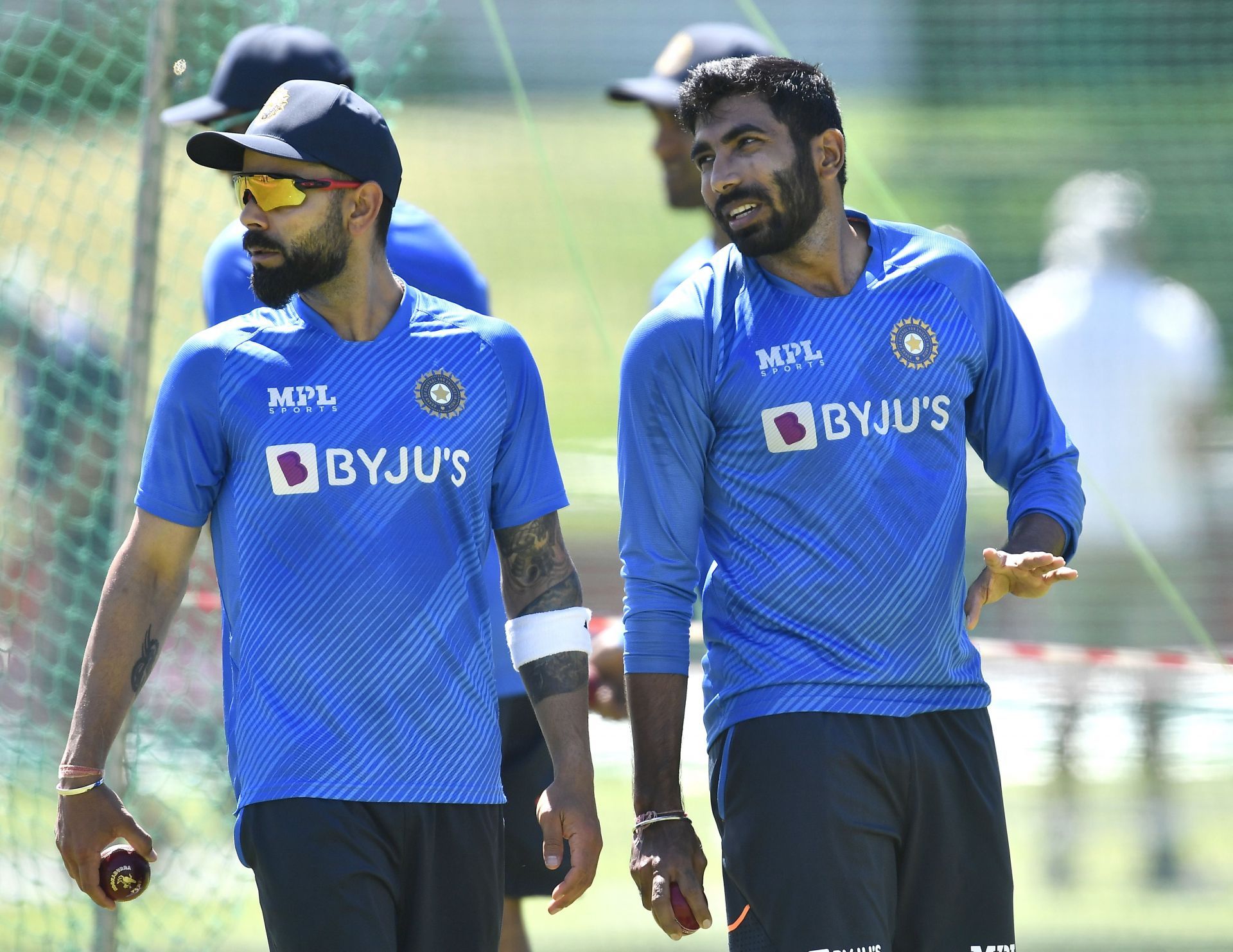 Virat Kohli (L) and Jasprit Bumrah (R) during a training session at Newlands