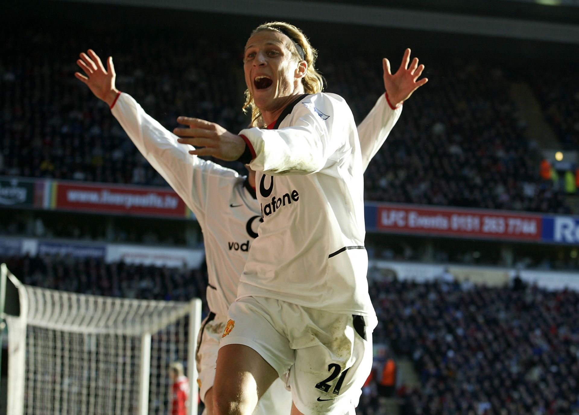 Diego Forlan of Manchester United celebrates scoring against Liverpool