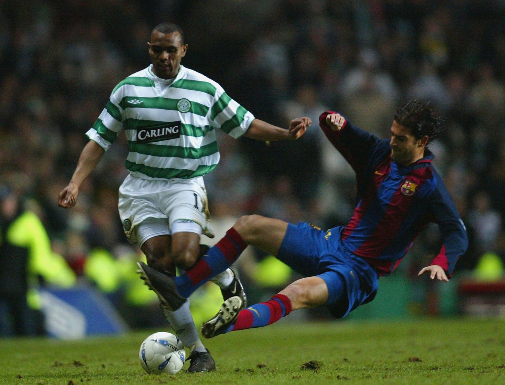 Lopez (right) challenges for the ball in UEFA Cup 4th round game vs Celtic