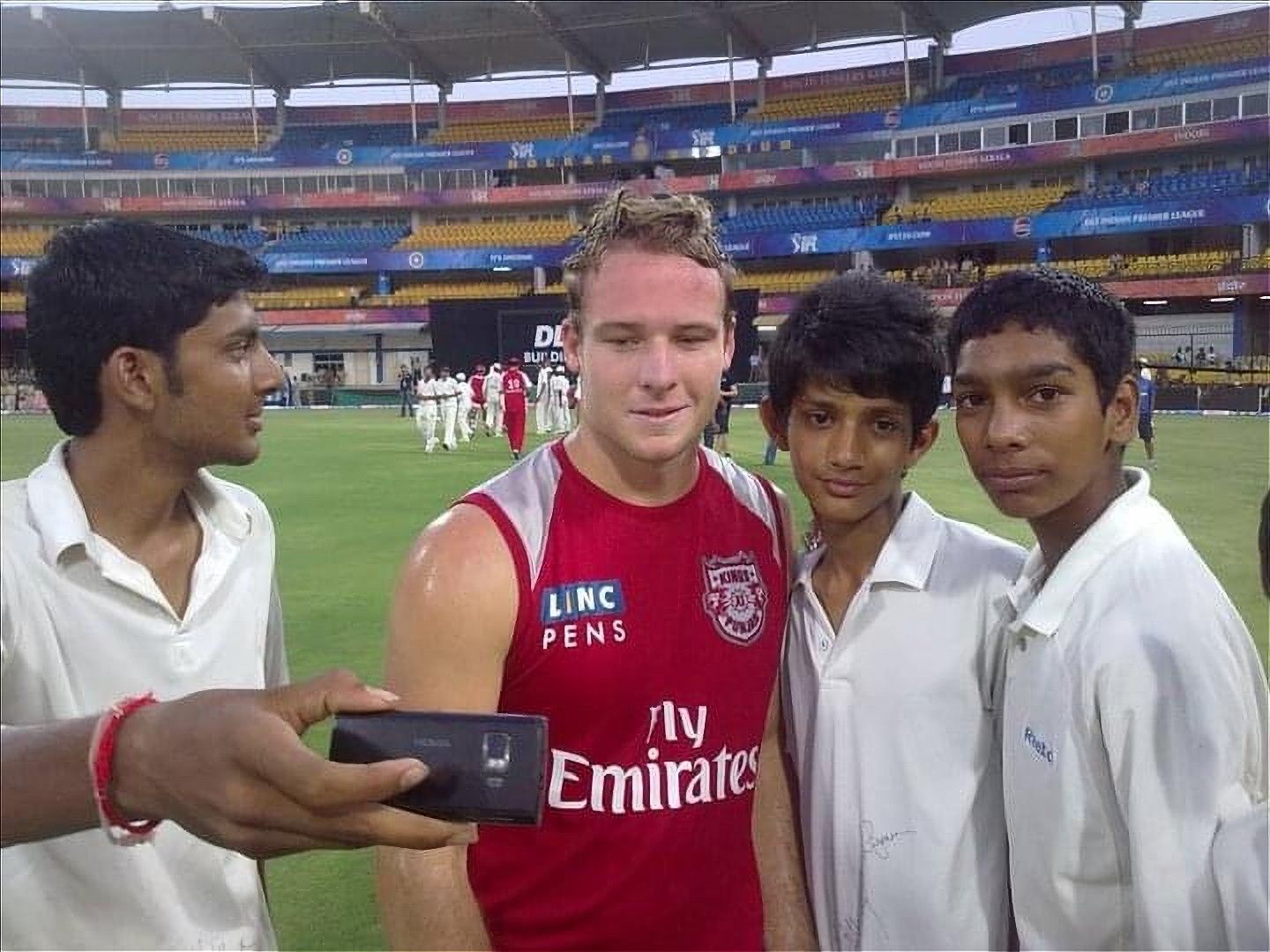 Venky and Suraj strike a pose with Punjab Kings&#039; David Miller during IPL 2011 [Credits: Suraj Thakuria]