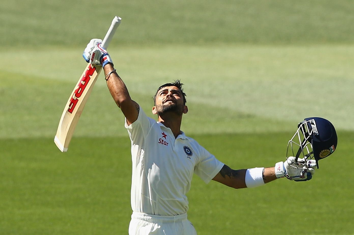 Virat Kohli celebrates his century in Adelaide in 2014.