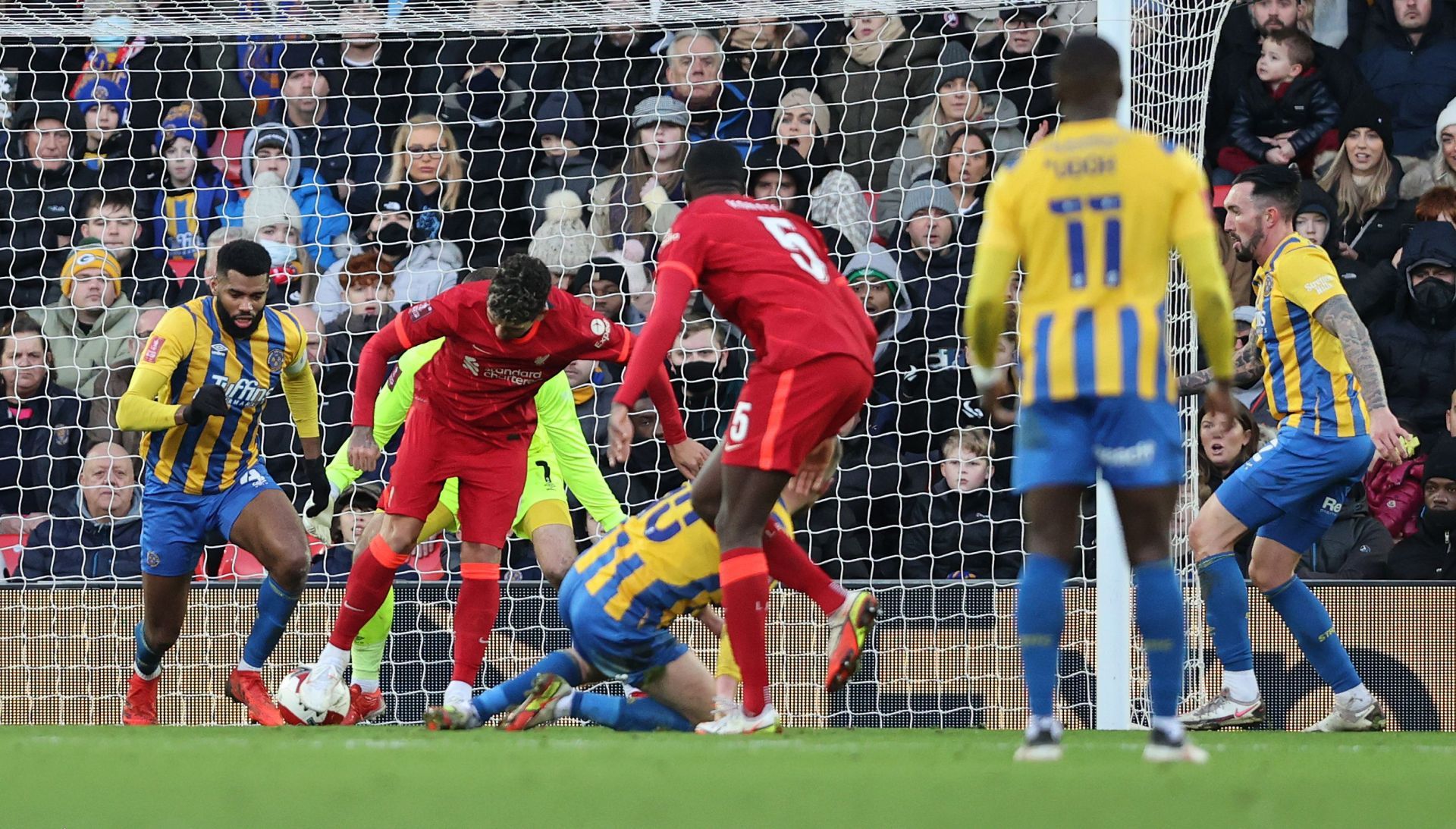 Roberto Firmino scores Liverpool's third of the game.