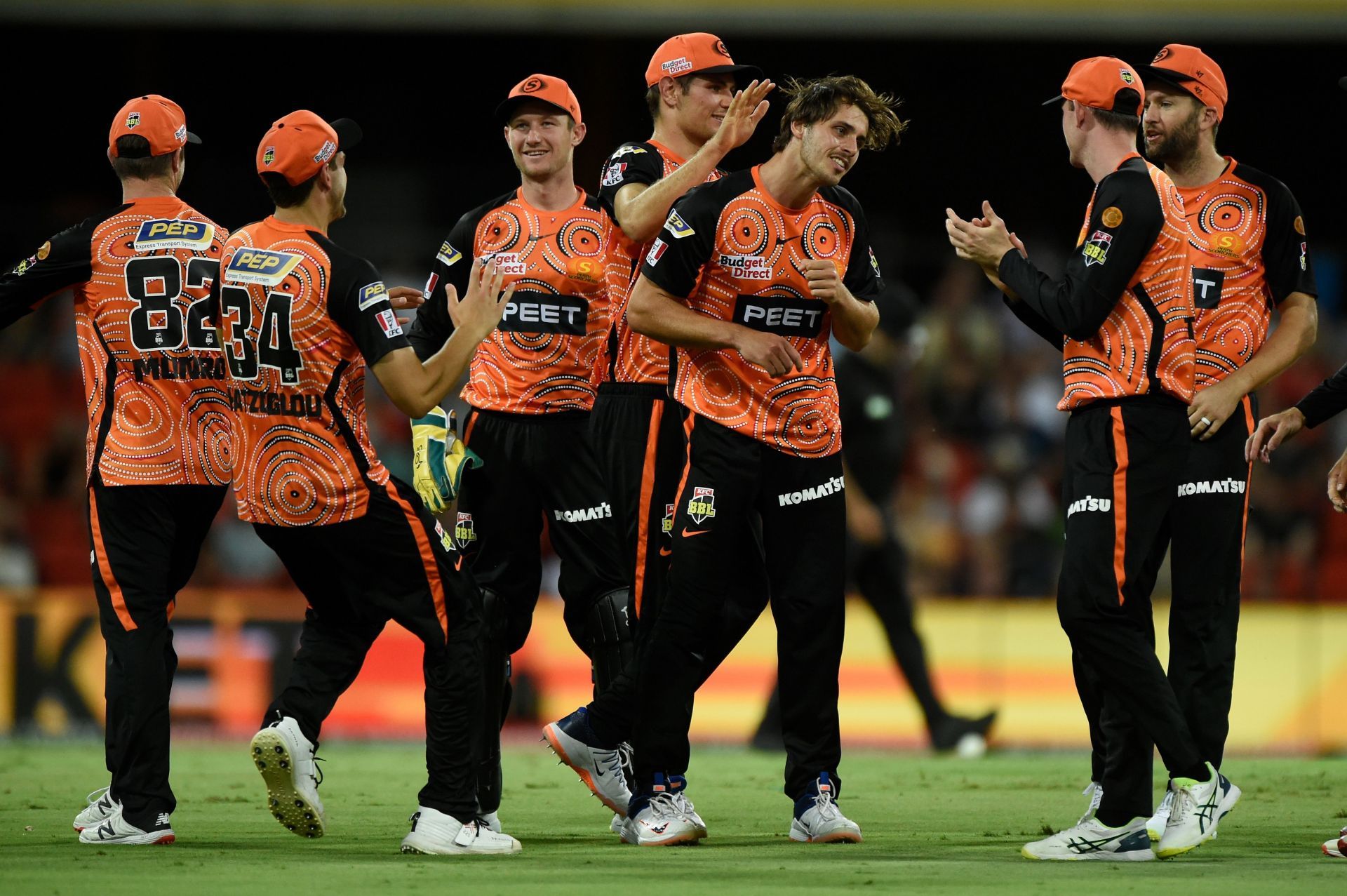 The Scorchers celebrating the fall of a wicket.