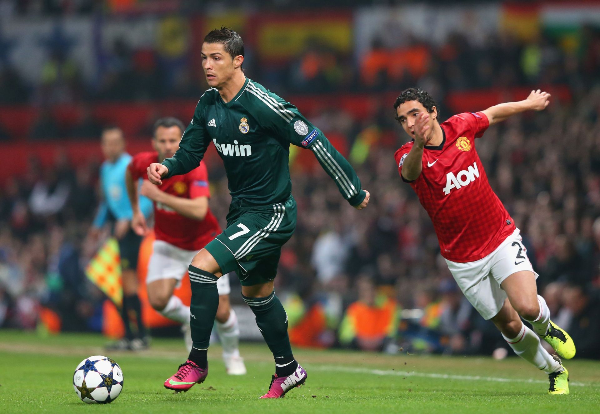 Cristiano Ronaldo of Real Madrid (#7) gets past Manchester United&#039;s Rafael da Silva.