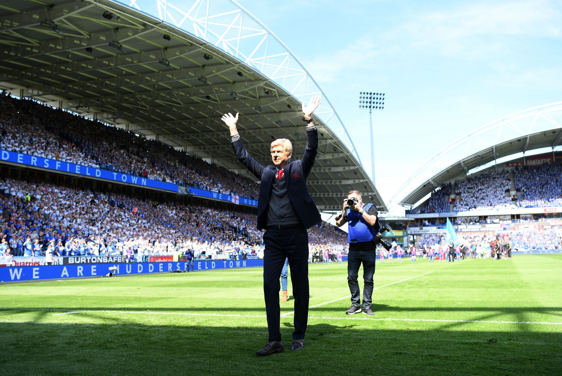 Frenchman Arsene Wenger soaks in the applause from Arsenal and Huddersfield fans.