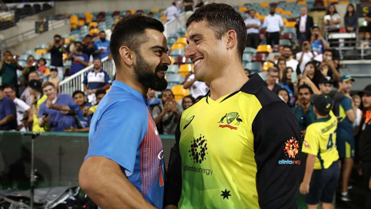 Marcus Stoinis (R) with former India captain Virat Kohli.